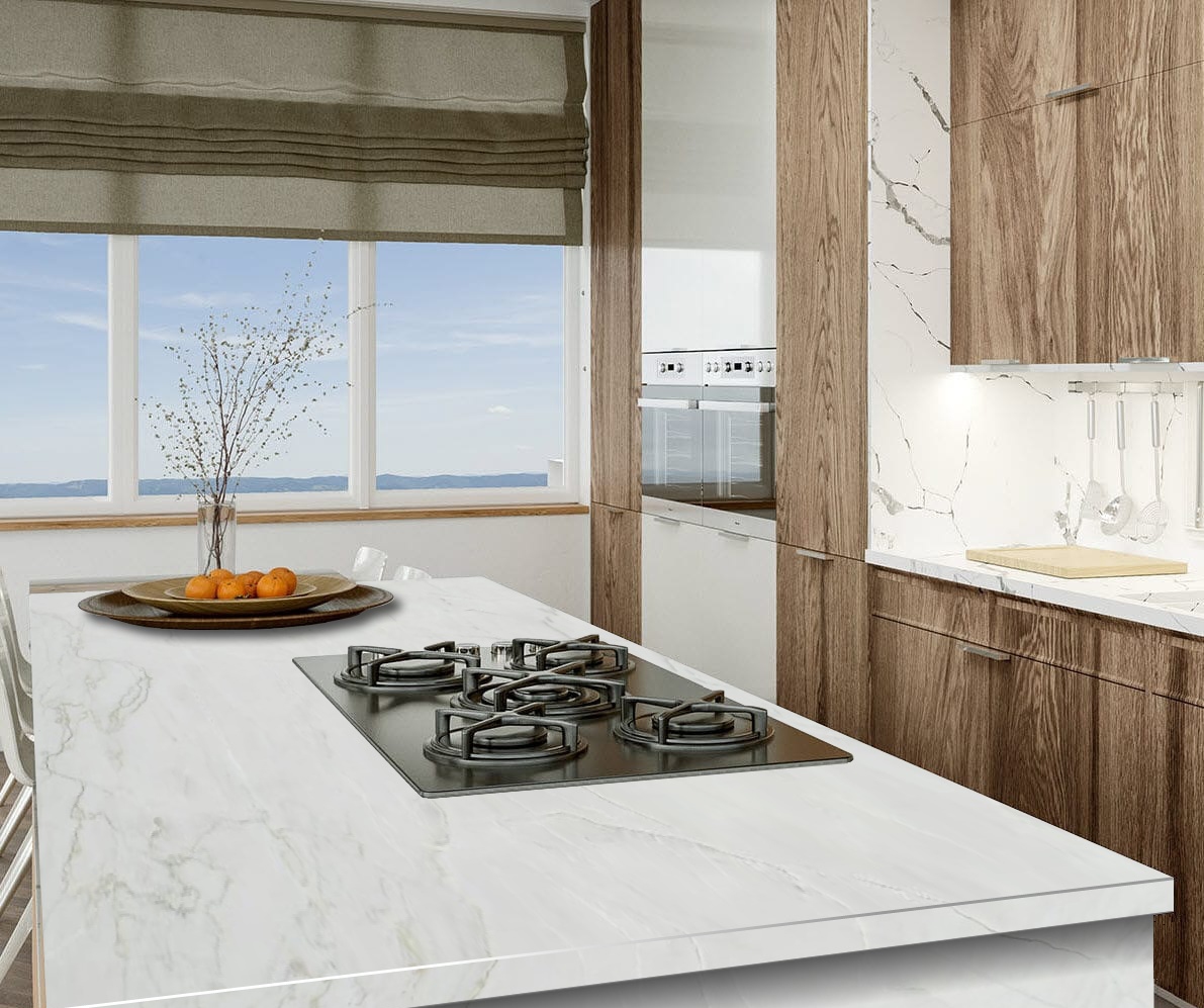 Bright kitchen with Calacatta quartzite island, oak cabinetry and panoramic ocean view