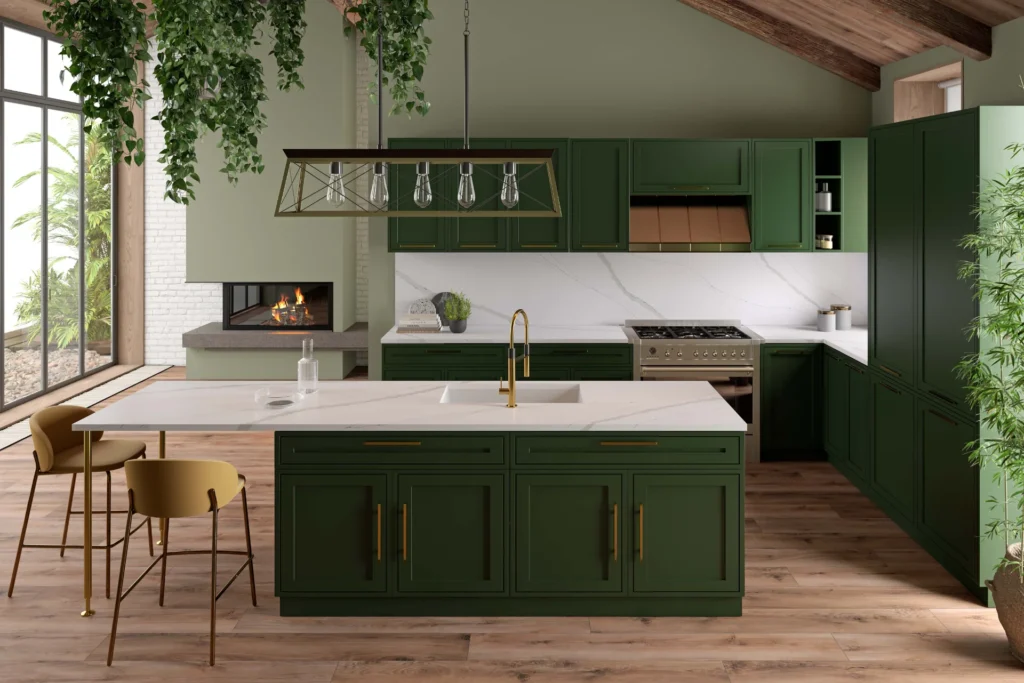 Modern kitchen with Viatera Calacatta Verde countertops, dark green cabinets, gold hardware, wood floors, and a fireplace.
