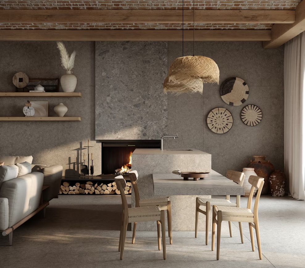 Modern living room with concrete fireplace, cozy sofa, dining area, woven decor, and natural wood accents.