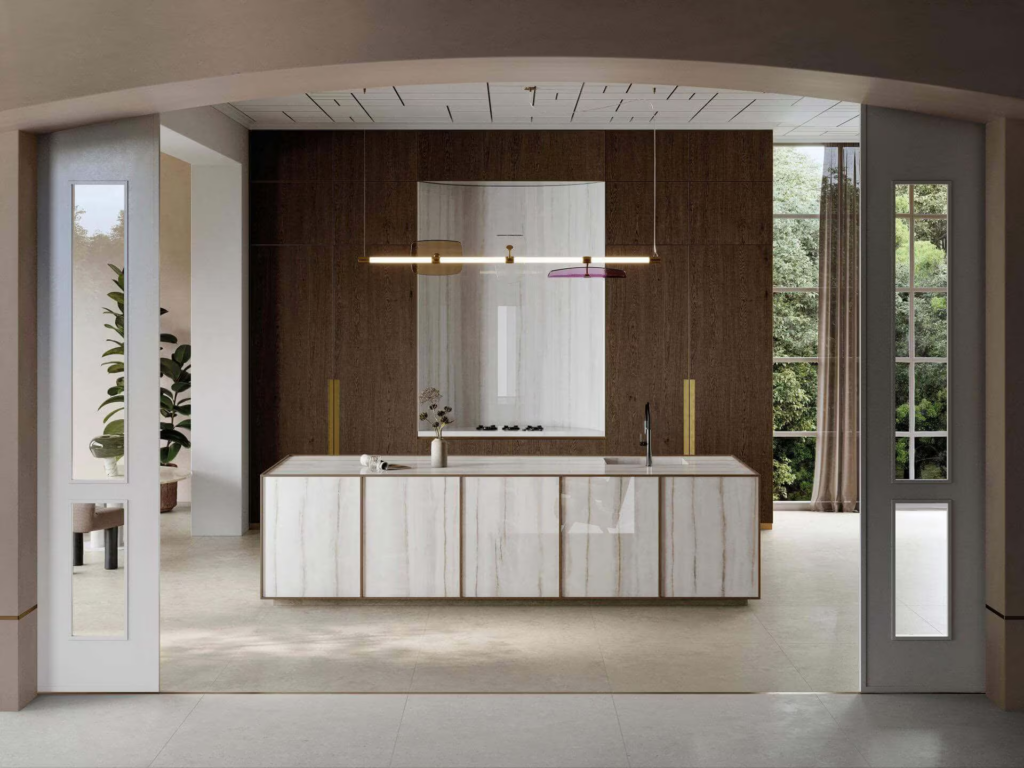 Modern kitchen island with marble cabinets, dark wood paneling, and an elegant linear light fixture.
